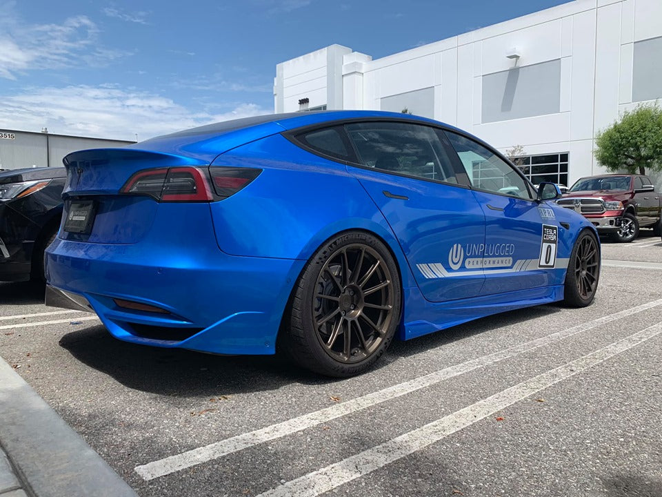 UNPLUGGED PERFORMANCE UP-M3-304-1.1 Ascension Rear Bumper, Autoclaved Dry Carbon Raw for TESLA Model 3 Photo-0