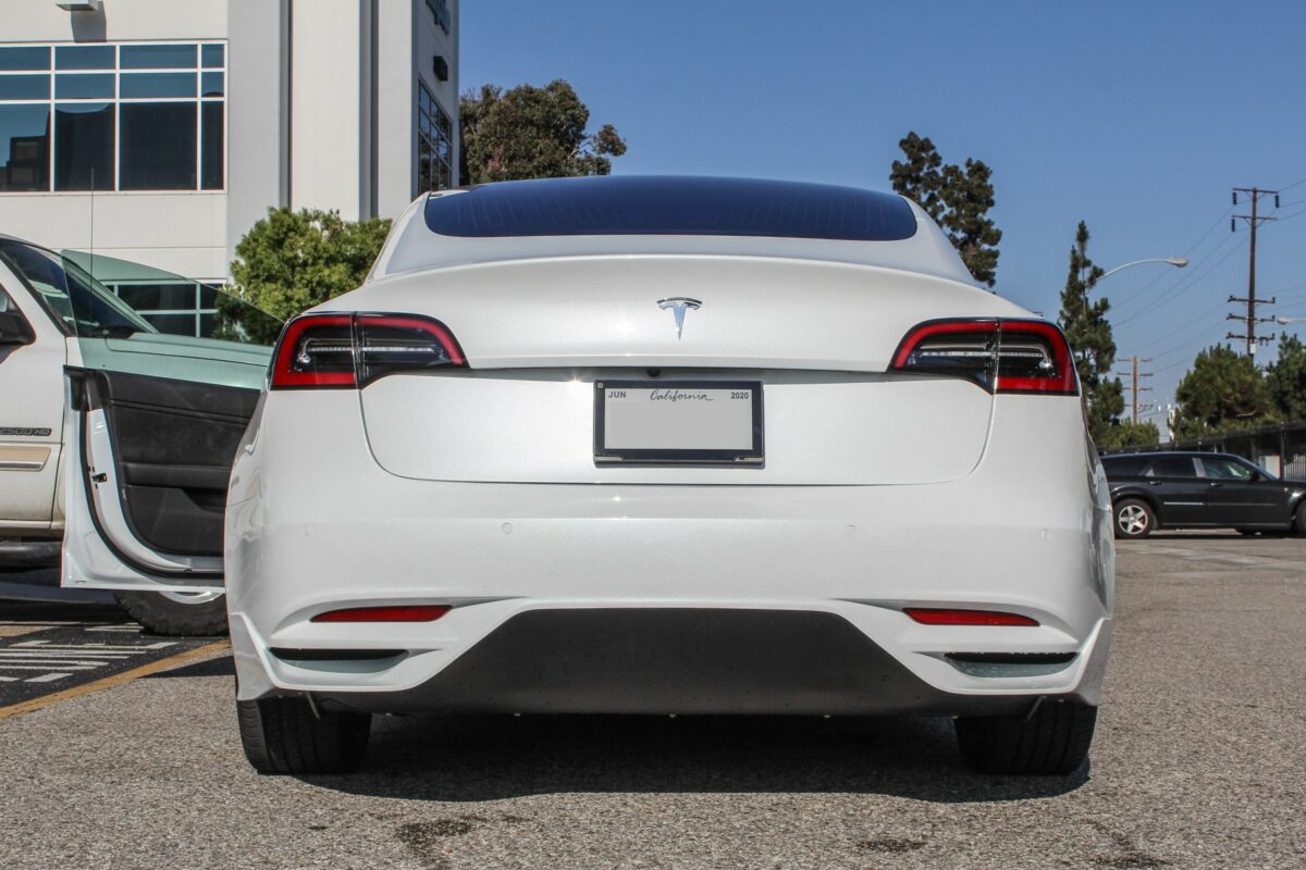 UNPLUGGED PERFORMANCE UP-M3-304-1.1 Ascension Rear Bumper, Autoclaved Dry Carbon Raw for TESLA Model 3 Photo-1