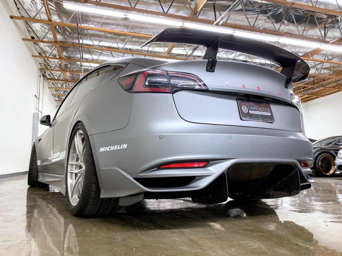 UNPLUGGED PERFORMANCE UP-M3-304-4.1 Ascension Rear Bumper - Optional Ascension-R Rear Diffuser Fins, Dry Carbon Gloss Clear for TESLA Model 3 Photo-0