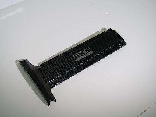 HKS 45999-AM002 Carbon Plug Cover for MITSUBISHI LANCER EVOLUTION 4-9 (CN9A/CP9A/CT9A/CT9W) 1999-2007 Photo-0