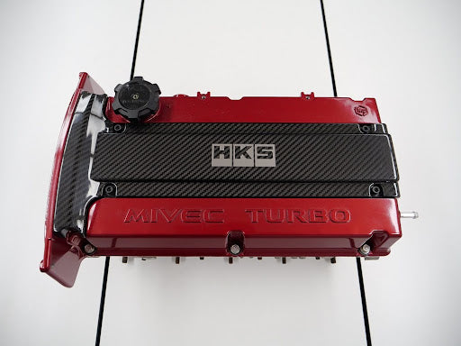 HKS 45999-AM002 Carbon Plug Cover for MITSUBISHI LANCER EVOLUTION 4-9 (CN9A/CP9A/CT9A/CT9W) 1999-2007 Photo-1