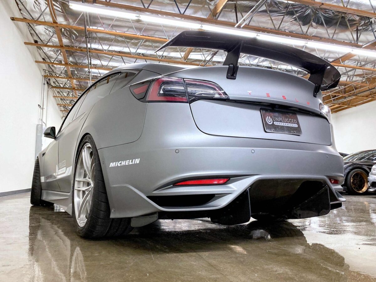 UNPLUGGED PERFORMANCE UP-M3-304-4.1 Ascension Rear Bumper - Optional Ascension-R Rear Diffuser Fins, Dry Carbon Gloss Clear for TESLA Model 3 Photo-0 